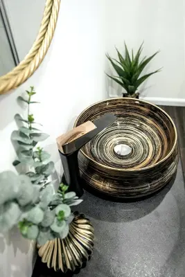 a wooden coil sitting on a table with plants at Luxury Loft in Kaunas