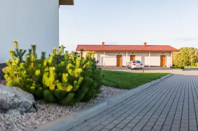 a pineapple bush in front of a house at Motel Panorama in Šiauliai