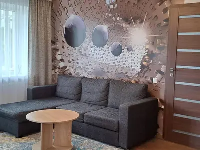 a living room with a couch and a table at Trumpalaikė nuoma centre in Šiauliai