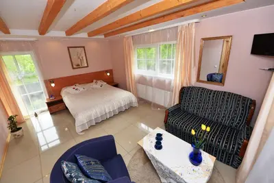 a living room with a bed and a couch at 