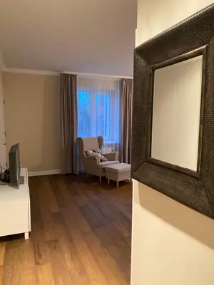a living room with a television and a couch at Studio flat in Kedainiai in Kėdainiai