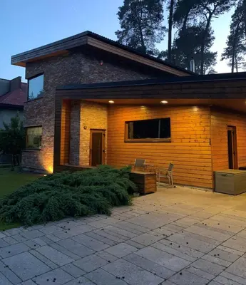 a brick house with a patio in front of it at Kulautuva Rest Home Large Space in Kulautuva