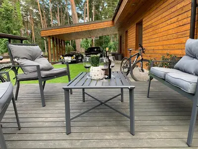 a patio with a table and two chairs and a bike at Kulautuva Rest Home Large Space in Kulautuva