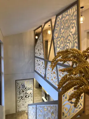 a staircase in a house with blue and white tiles at Sodyba Pelėdų medus in Vainekoniai