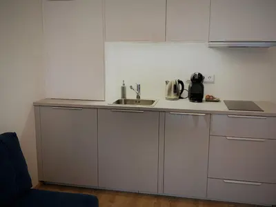 a kitchen with a sink and a counter top at COZY Nest apartment in Kaunas in Kaunas