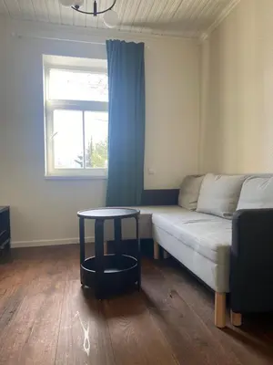 a living room with a couch and a table at 