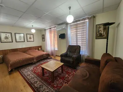 a living room with a couch and a table at Solo studio in Birštonas
