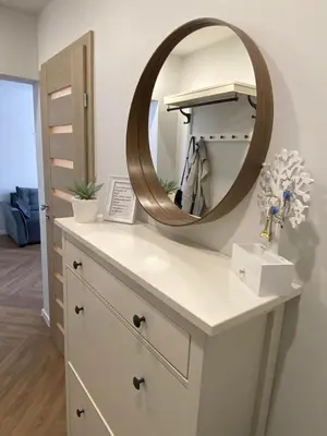 a bathroom vanity with a mirror on top of it at DanGinta in Druskininkai