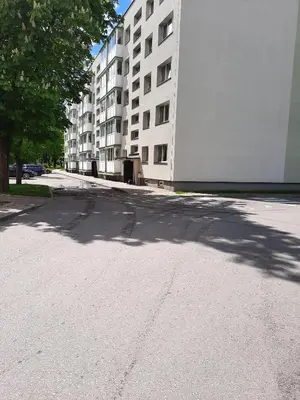 an empty street in front of a large building at DanGinta in Druskininkai