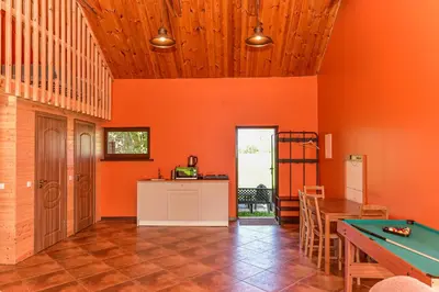 a dining room with a pool table in it at Spacious Loft in the Nature in Molėtai