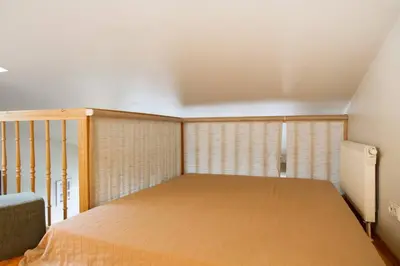 a bedroom with a large bed in a room at Penthouse Apartment with Great Panoramic City View in Vilnius
