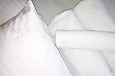 a pile of white towels next to a pile of paper towels at Šeduvos malūnas in Šiauliai