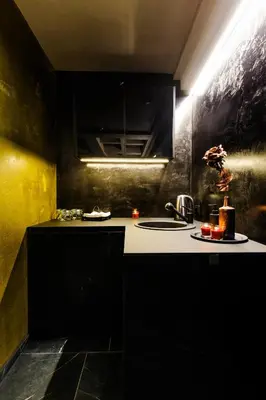 a kitchen with a sink and a counter top at Apartments in Kaunas city centre with Jacuzzi bath in Kaunas