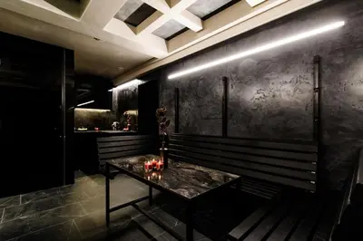a black room with a table with bottles on it at Apartments in Kaunas city centre with Jacuzzi bath in Kaunas