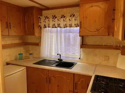 a kitchen with a sink and a window at NeriPaulis in Ažvinčiai
