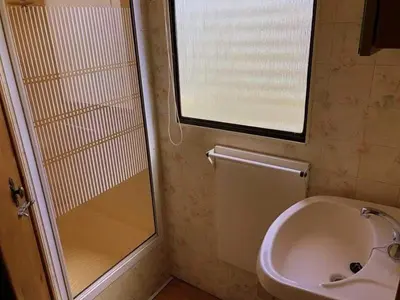 a bathroom with a shower and a sink and a toilet at NeriPaulis in Ažvinčiai