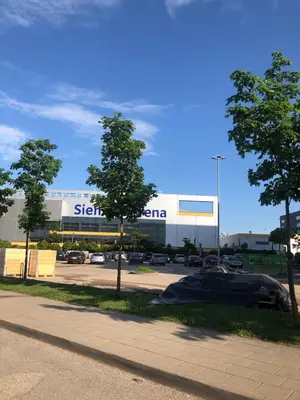 a building with a sign on the side of a road at Ozas Apartment 1 and 2 in Vilnius