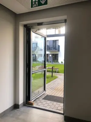 an open door with a view of a building at Ozas Apartment 1 and 2 in Vilnius