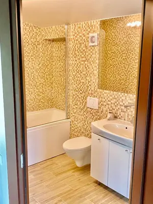 a bathroom with a toilet and a sink and a shower at Marijampole Camping in Marijampolė