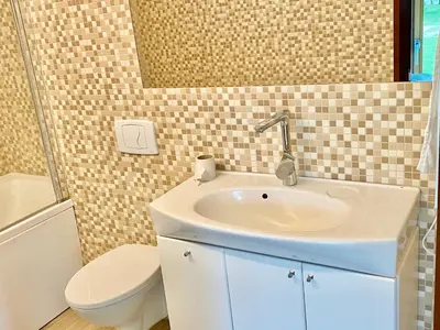 a bathroom with a sink and a toilet at Marijampole Camping in Marijampolė