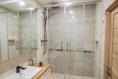 a bathroom with a shower and a sink at Central and Relaxing apartment in Druskininkai