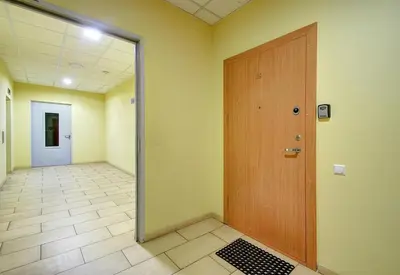an empty hallway with a door in a room at Helios Luxury apartment in Vilnius skyscraper in Vilnius