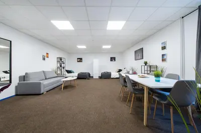 an office with a couch and a table and chairs at The house Vilnius in Vilnius