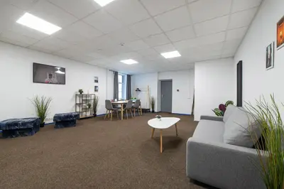a living room with a couch and a table at The house Vilnius in Vilnius