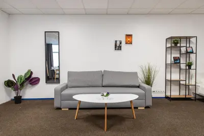 a living room with a couch and a table at The house Vilnius in Vilnius