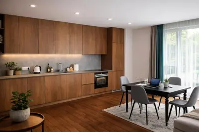 a kitchen with a table and chairs in a room at Centro apartamentai in Birštonas