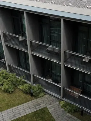 an external view of a building with balconies at Mana Sleep & Spa in Druskininkai