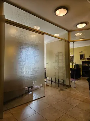 a large display case in a room with a wall at Barrister's apartments with fireplace in Šiauliai