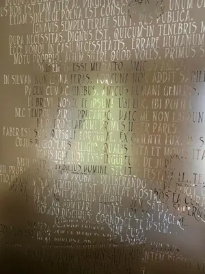 a wall covered in writing on the ceiling of a building at Barrister's apartments with fireplace in Šiauliai