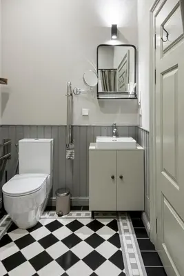 a bathroom with a toilet and a sink at Zyplių Dvaro Oficina Viešbutis in Lukšiai