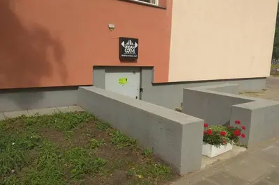 a building with a sign on the side of it at Slucko Central Studio Apartment near River in Vilnius