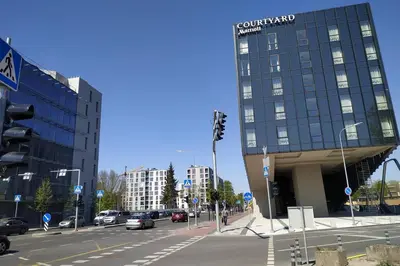 a city street with a building with cars on it at 9th floor Amazing View Central Studio Apartment in Vilnius