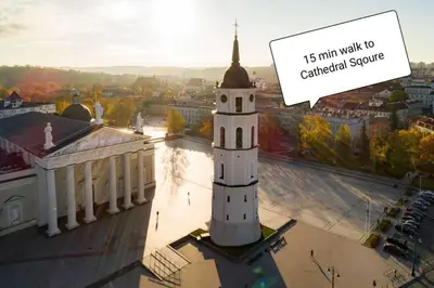 a clock tower on top of a building at 9th floor Amazing View Central Studio Apartment in Vilnius