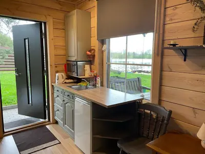 a kitchen with a sink and a counter top at Atostogų būstas in Kurėnai