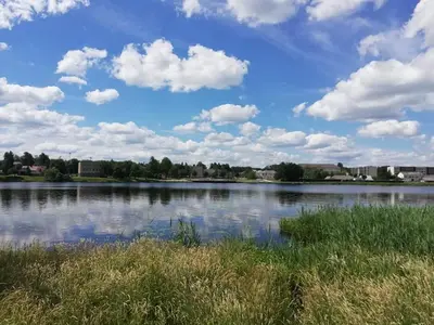 a view of a lake with clouds in the sky at Ramus poilsis prie Širvintų marių in Širvintos