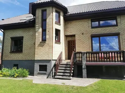 a house with a staircase in front of it at Ramus poilsis prie Širvintų marių in Širvintos
