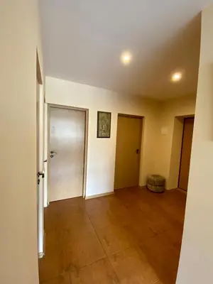 an empty room with a door and a tile floor at Apartamentai Vytauto 16 in Druskininkai