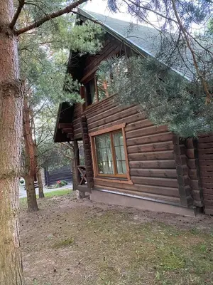 a log cabin with a window on the side of it at Šeimyninis namelis nr.1 in Kurėnai