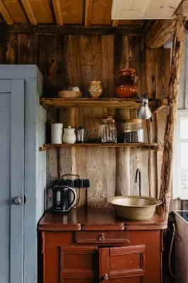 a kitchen with a counter with a sink and shelves at Vienkiemio Oazė - Autentiškas Kluonas in Galvokai