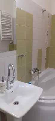 a bathroom with a sink and a toilet at Laisvės 50D in Kaunas