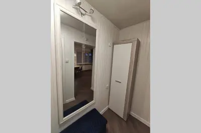 an empty hallway with a mirror and a door at Cozy stay in unique town - Kėdainiai in Kėdainiai