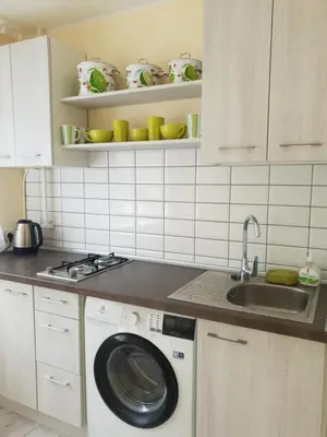 a kitchen with a washing machine and a sink at Lima C in Druskininkai