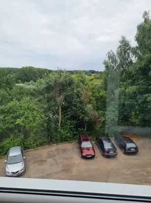 a group of cars parked in a parking lot at Pas Romaną in Zarasai