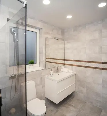 a bathroom with a toilet and a sink and a shower at Laurentroom Central Park in Ukmergė