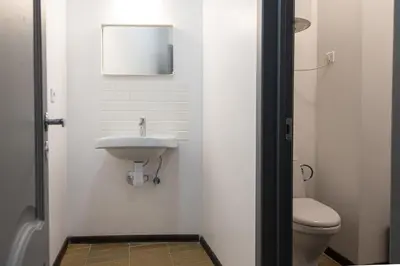 a bathroom with a sink and a toilet at The house black in Vilnius