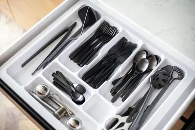 a white container with utensils in it at Old-New Apartment in Central Kaunas in Kaunas
